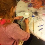 On small paper tubes (easy to make), paint blue and "twirl" when adding the white stripe!